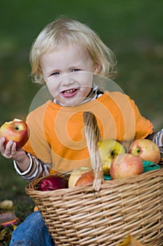 Cute Blond Child Eating an Apple