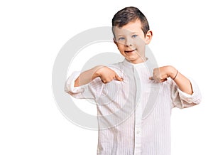 Cute blond kid wearing elegant shirt looking confident with smile on face, pointing oneself with fingers proud and happy photo