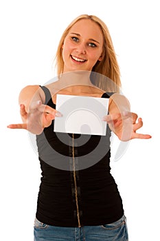 Cute blond woman with blank white banner in her hands smiling is