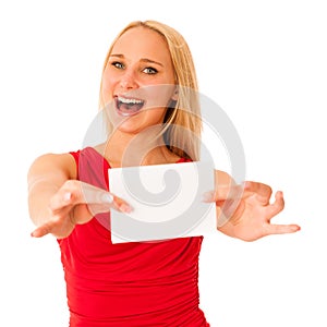 Cute blond woman with blank white banner in her hands smiling is