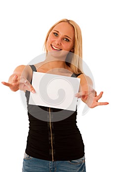 Cute blond woman with blank white banner in her hands smiling is