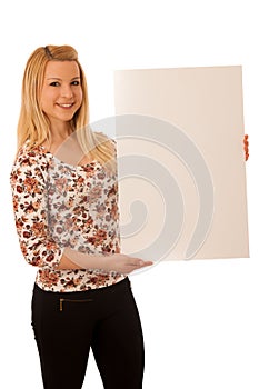 Cute blond woman with blank white banner isolated over white background