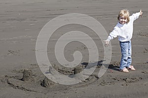Cute Blonde Child Playing at the Beach