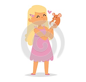 Cute blonde girl in pink dress holding a brown mouse with love. Child showing affection to small rodent pet. Friendship