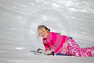 Cute blue eyed girl in the snow with copy space.