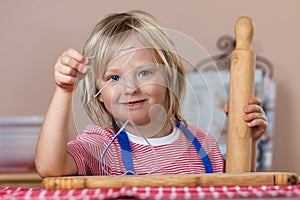 Cute boy baking ginger bread cookies