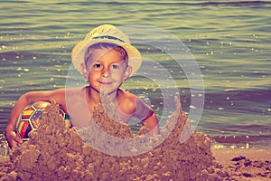 Cute boy on the beach.