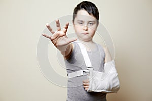 Cute boy with broken arm