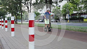 A cute boy catches up with his father on rollerblades.