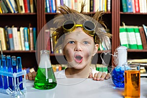 Cute boy doing biochemistry research in chemistry