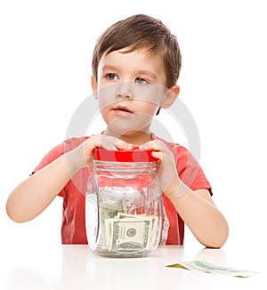 Cute boy with dollars