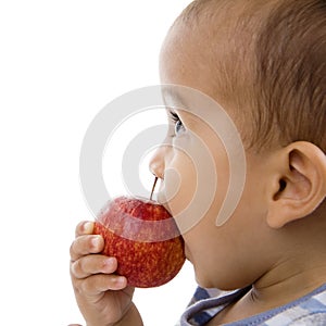 Cute boy eating an apple