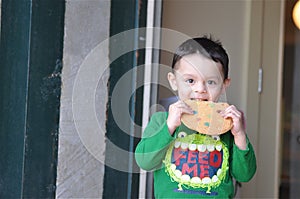Cute Boy Enjoying a Cookie