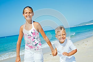 Cute boy and girl on the beach