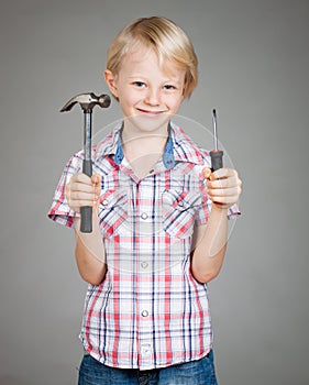 Cute boy hammer and screwdriver