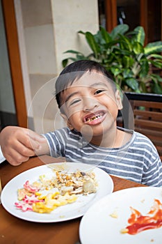 A cute boy having breakfast