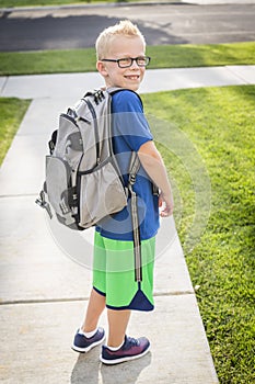 Cute boy heading off to school in the morning