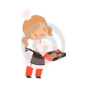 Cute Boy Holding Baking Cookies, Cute Little Chef Character in Uniform Cooking in the Kitchen Cartoon Style Vector