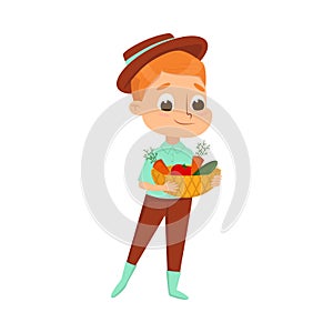 Cute Boy Holding Basket of Fresh Ripe Vegetables, Little Kid Farmer Character Working in Garden Cartoon Style Vector