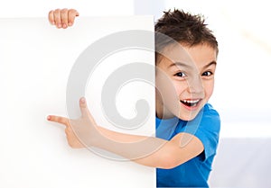 Cute boy is holding blank banner