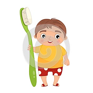 Cute boy  holding a toothbrush