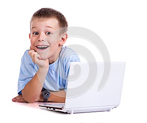 Cute boy with laptop on white