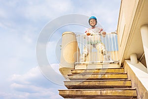 Cute boy look down from safe door in bubble wrap