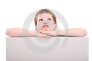 Cute boy looking up with white board