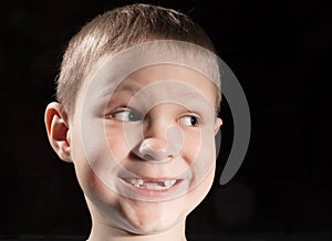 Cute boy missing some front teeth