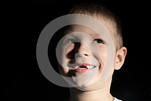 Cute boy missing some front teeth