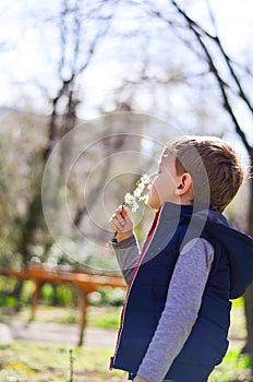 Cute boy outdoor at a spring time