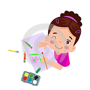 Cute boy painting with watercolors and colored pencils