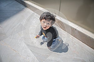 Cute boy playing on the streets of the metropolis