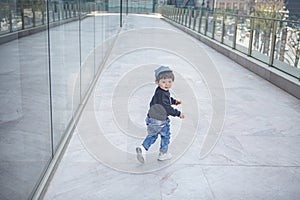 Cute boy playing on the streets of the metropolis