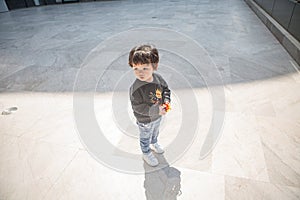 Cute boy playing on the streets of the metropolis