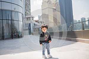 Cute boy playing on the streets of the metropolis