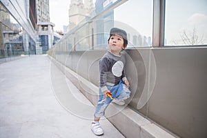 Cute boy playing on the streets of the metropolis