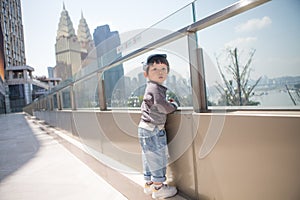 Cute boy playing on the streets of the metropolis