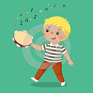 Cute boy playing tambourine on green background