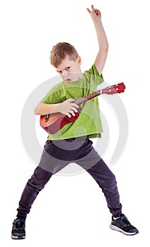Cute boy playing the ukulele guitar