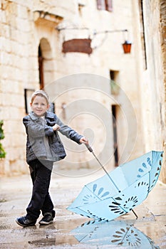 Cute boy on rainy day