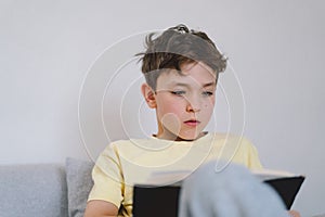 Boy reading an interesting book