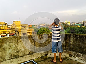 Cute boy on a roof