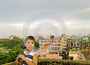 Cute boy on a roof