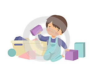 Cute Boy Sitting on Floor and Cleaning Up His Toys, Kid Doing Housework Chores at Home Vector Illustration