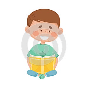 Cute Boy Sitting on the Floor with Open Book and Reading Vector Illustration