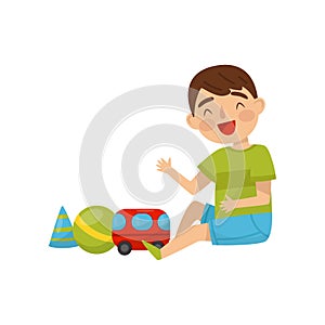 Cute boy sitting on the floor playing with toys, kids activity, daily routine vector Illustration on a white background