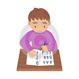 Cute Boy Sitting at his Desk and Writing, Elementary School Student Writing English Letters in Notebook Cartoon Vector