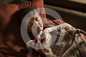 Cute boy sleeping on the sofa