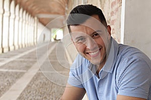 Cute boy smiling outdoors close up with copy space